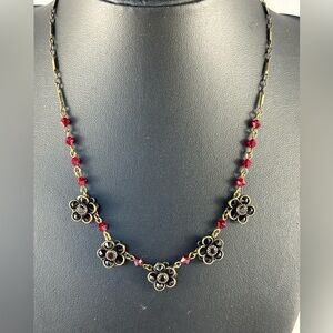 Liz Paiacios dark red crystal necklace in antique brass